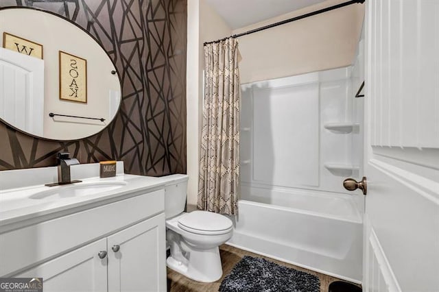 full bathroom with toilet, vanity, and shower / tub combo with curtain