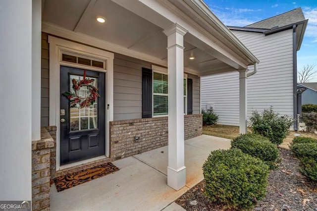 property entrance with covered porch