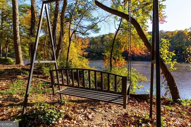 view of gate with a water view