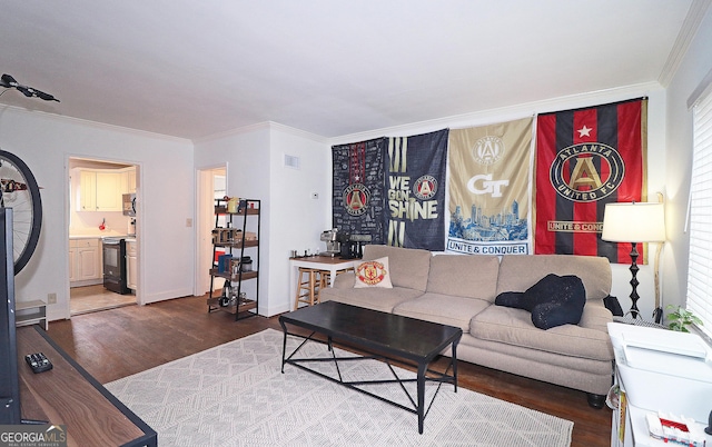 living room with ornamental molding and wood-type flooring