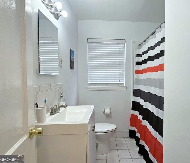 bathroom featuring a shower with curtain, toilet, tile patterned floors, and vanity