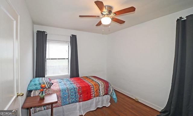 bedroom with ceiling fan and hardwood / wood-style floors