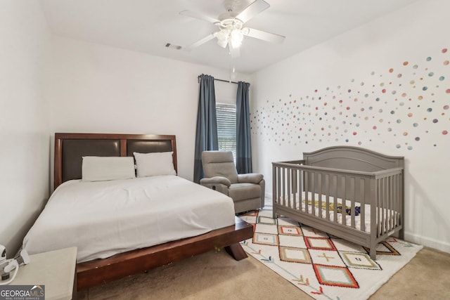 carpeted bedroom featuring ceiling fan