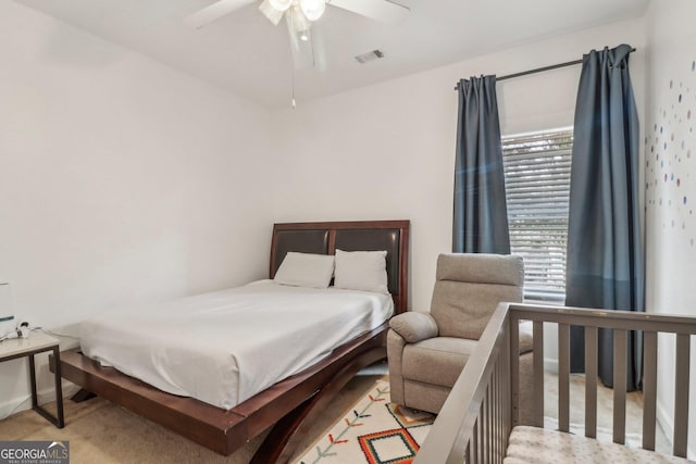 carpeted bedroom with ceiling fan