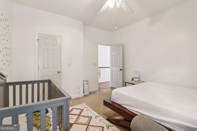 carpeted bedroom with ceiling fan