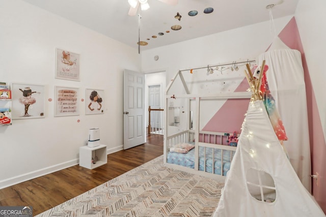 bedroom with hardwood / wood-style floors