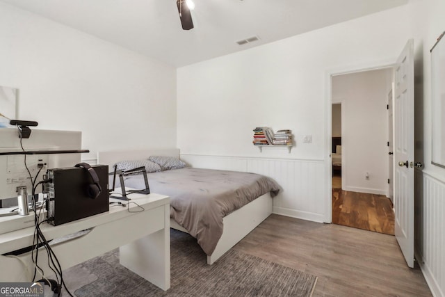 bedroom featuring ceiling fan and hardwood / wood-style floors