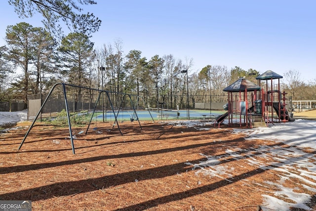 view of jungle gym with tennis court