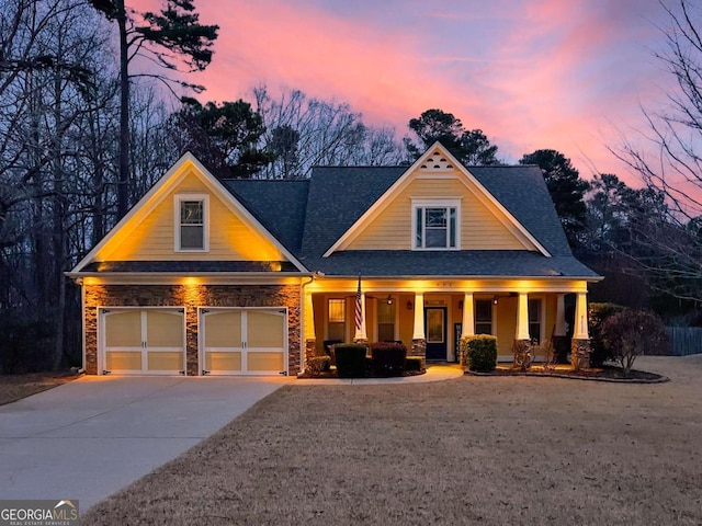 craftsman-style house featuring a garage and a porch