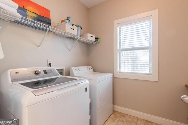 washroom featuring light tile patterned floors and independent washer and dryer