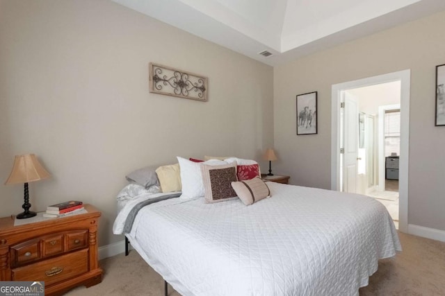 bedroom featuring light carpet