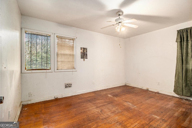 spare room with wood-type flooring and ceiling fan