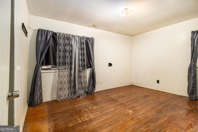 spare room with hardwood / wood-style floors