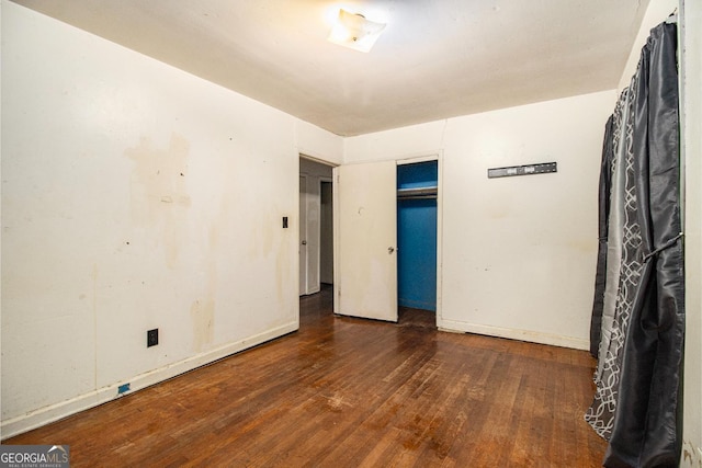 spare room featuring dark hardwood / wood-style floors