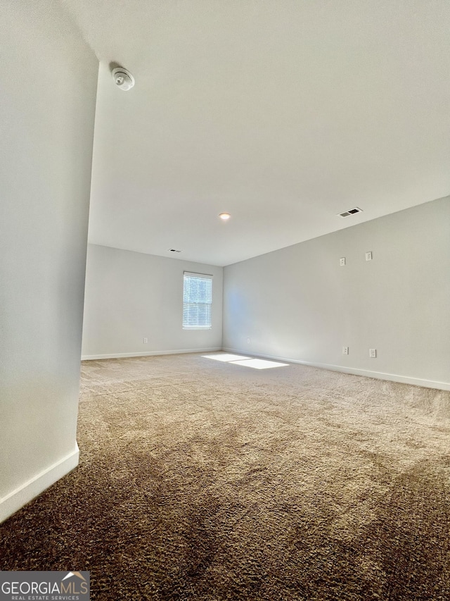 spare room featuring carpet floors