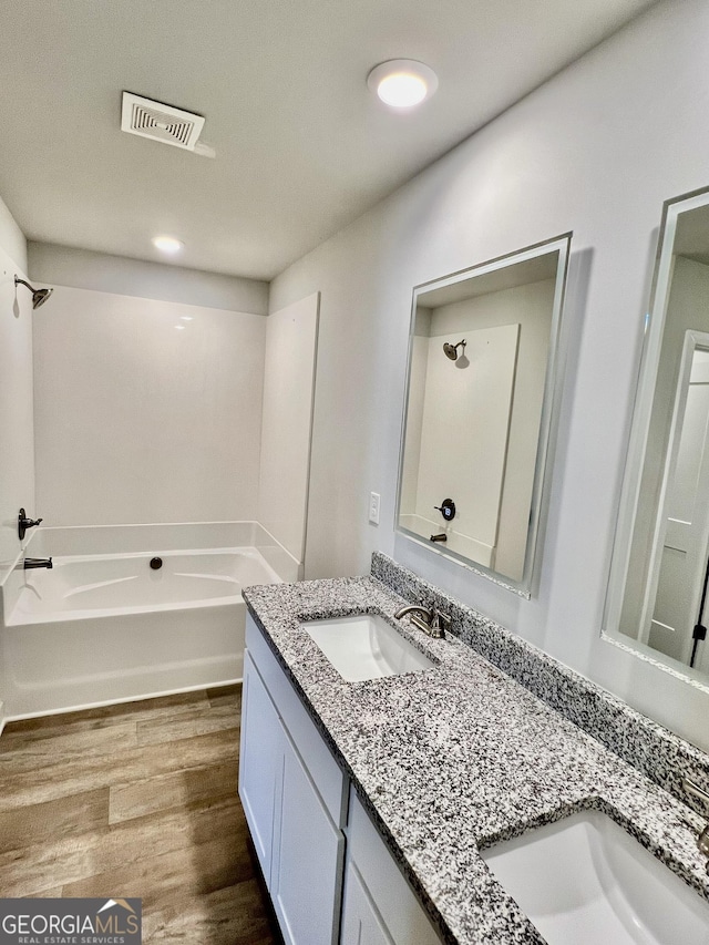 bathroom with wood-type flooring and vanity