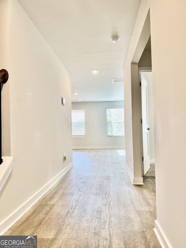 hall with light wood-type flooring