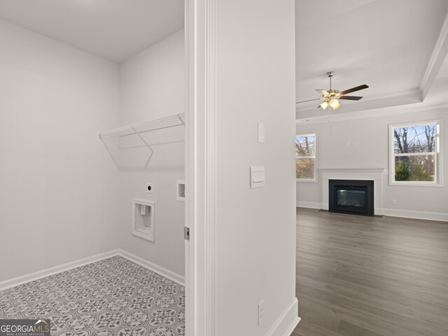 washroom featuring ornamental molding, hookup for an electric dryer, and ceiling fan