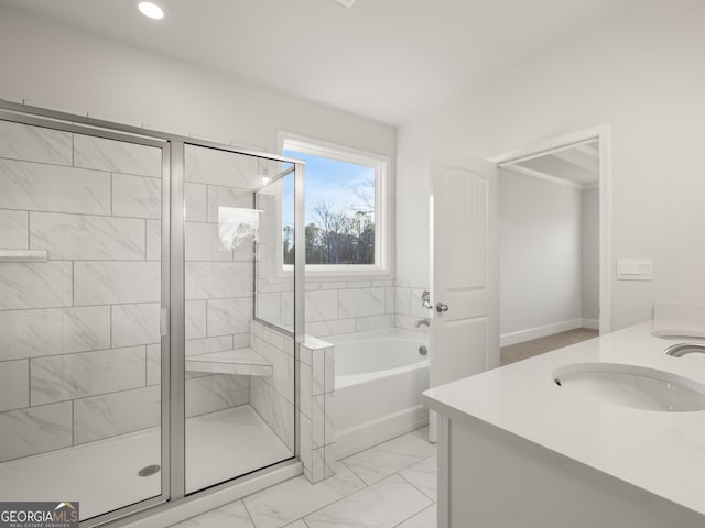 bathroom featuring independent shower and bath and vanity