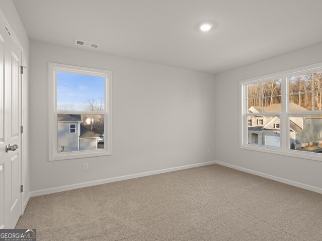 spare room with carpet flooring