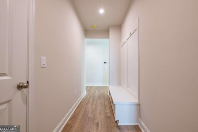 hall with light hardwood / wood-style flooring