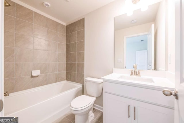 full bathroom featuring vanity, toilet, and tiled shower / bath