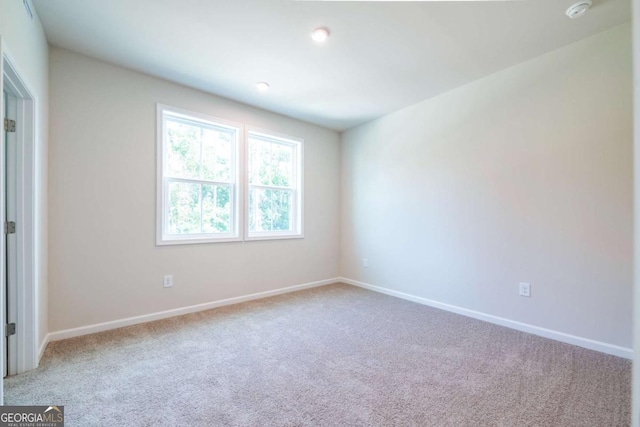 empty room with light colored carpet