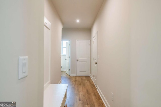 corridor featuring light hardwood / wood-style floors