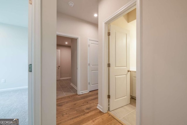 hall with light hardwood / wood-style flooring