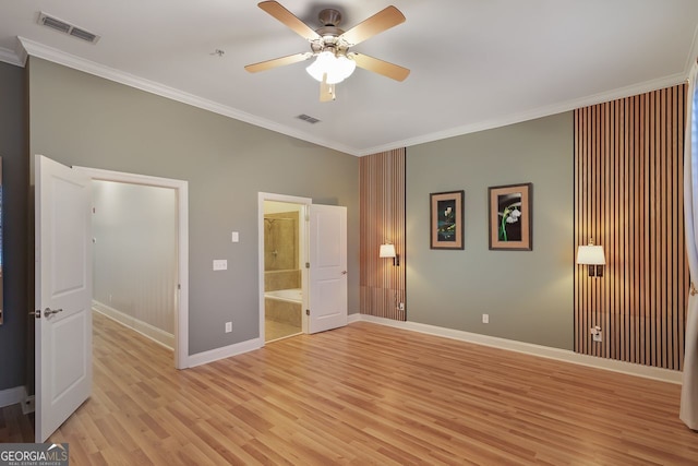 unfurnished bedroom with crown molding, connected bathroom, ceiling fan, and light hardwood / wood-style flooring