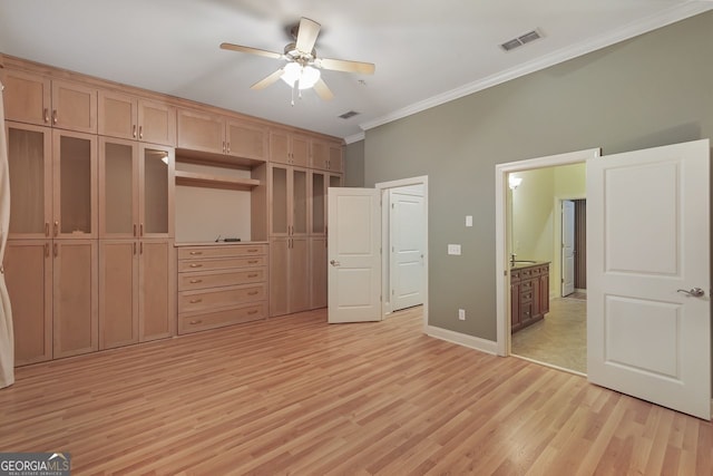 unfurnished bedroom featuring ornamental molding, ceiling fan, and light hardwood / wood-style floors