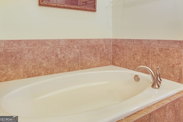 bathroom featuring a relaxing tiled tub