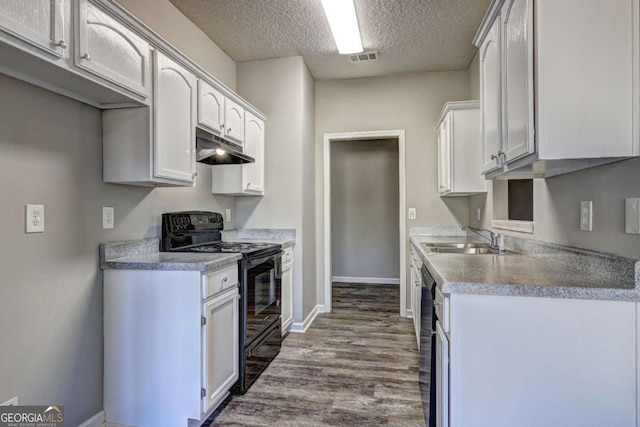 kitchen with a textured ceiling, black range with electric cooktop, white cabinets, sink, and dark wood-type flooring