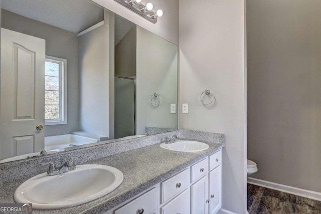 full bathroom with wood-type flooring, independent shower and bath, toilet, and vanity