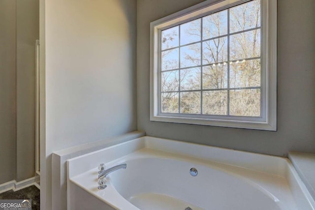 bathroom featuring a tub