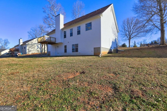 back of house with cooling unit and a lawn