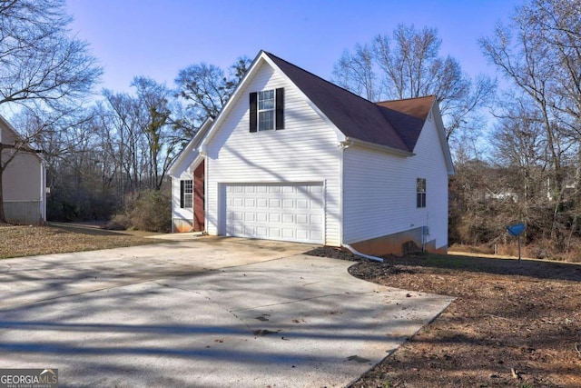 view of side of property featuring a garage