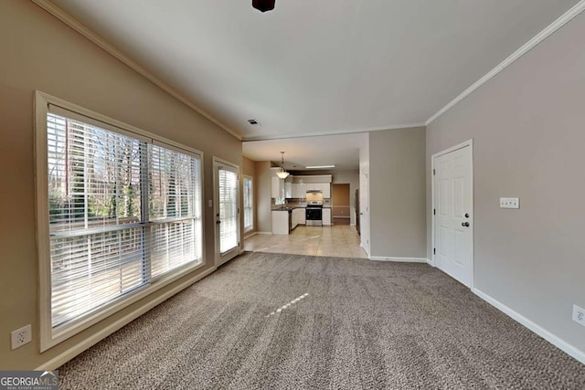 unfurnished living room featuring light colored carpet and crown molding