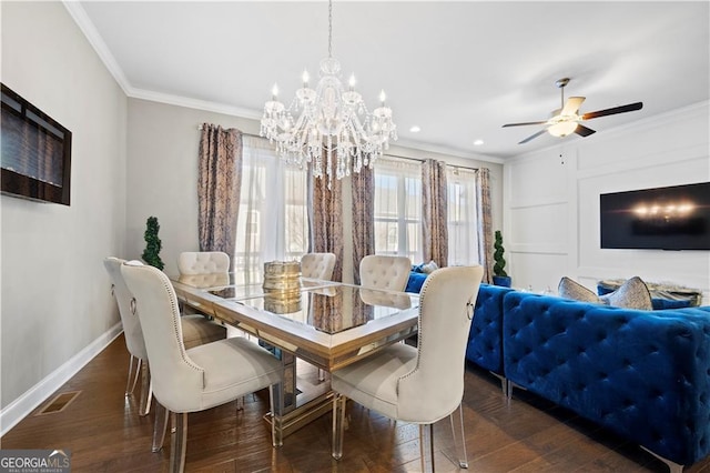 dining area with ceiling fan with notable chandelier, ornamental molding, and dark hardwood / wood-style floors