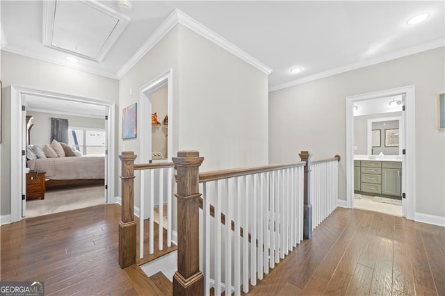 hallway featuring hardwood / wood-style flooring and ornamental molding