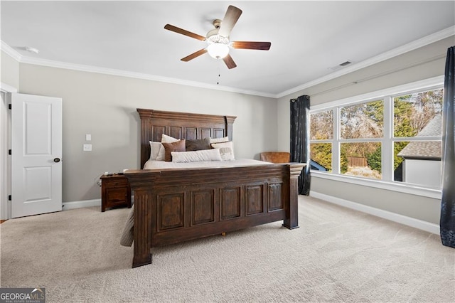 bedroom featuring light carpet, ceiling fan, and crown molding