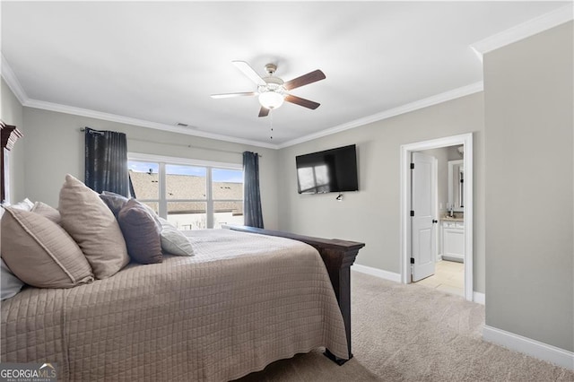 carpeted bedroom with crown molding, connected bathroom, and ceiling fan