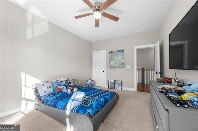 carpeted bedroom featuring ceiling fan