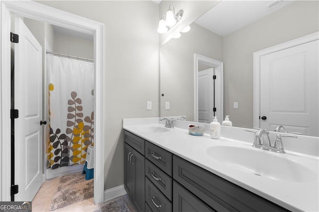 bathroom featuring vanity and a shower with shower curtain