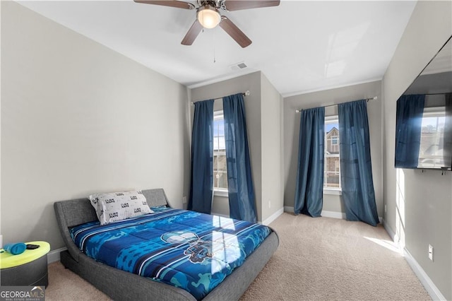 carpeted bedroom with ceiling fan