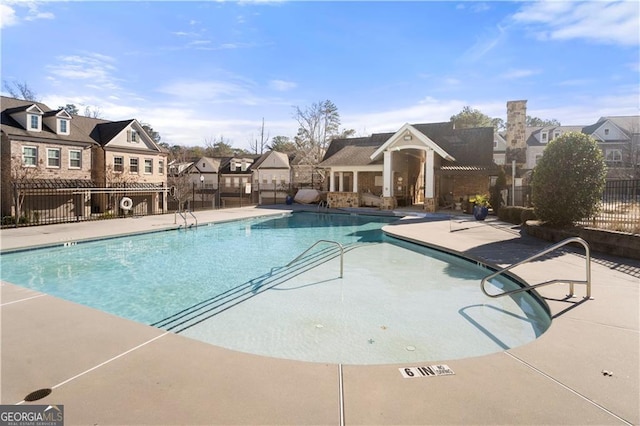 view of swimming pool with a patio area