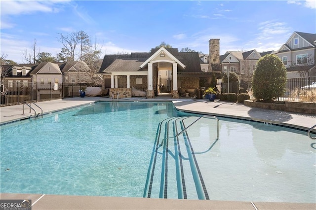 view of swimming pool with a patio area