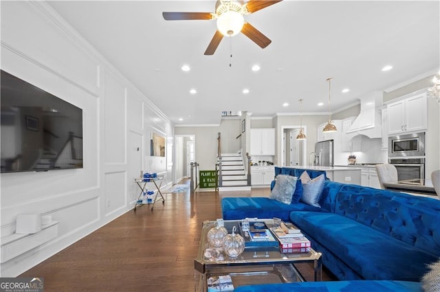 living room with ceiling fan, crown molding, and dark hardwood / wood-style flooring