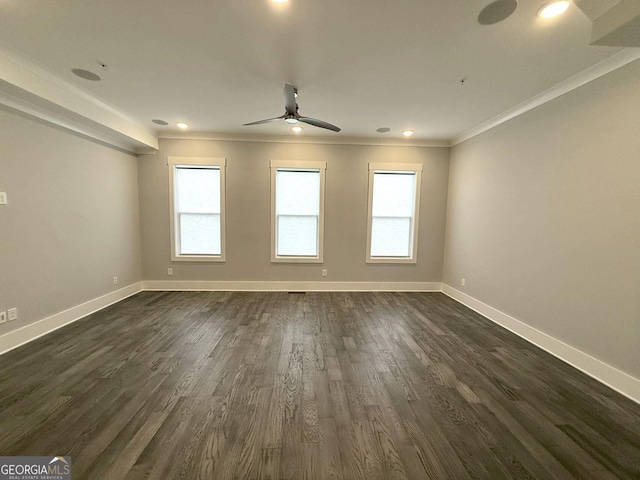 unfurnished room featuring crown molding, dark wood-type flooring, and ceiling fan