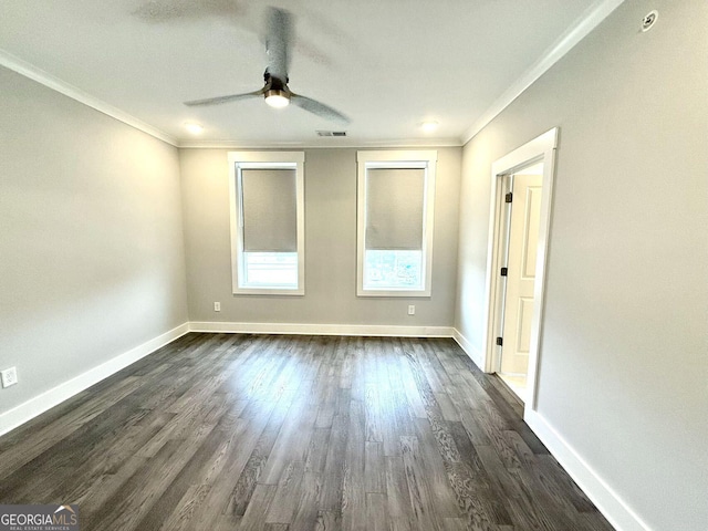 spare room with dark hardwood / wood-style flooring, ornamental molding, and ceiling fan